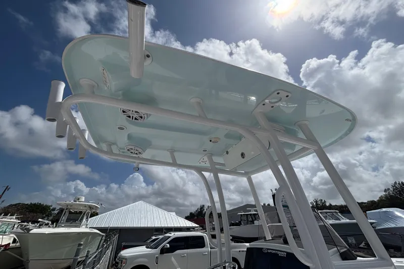 Slide: The Image of 2022 Sportsman Heritage 231 Center Console boat with T-top under a cloudy sky. - 7