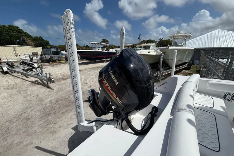 Slide: The Image of 2022 Sportsman Heritage 231 Center Console with Yamaha outboard motor in a boatyard. - 8