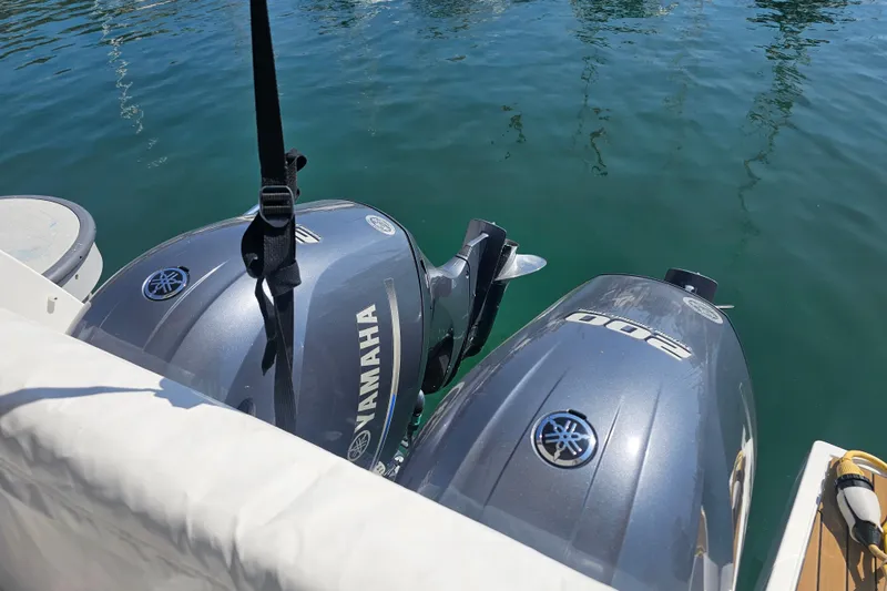 Slide: The Image of Twin Yamaha outboard engines on a 2023 Jeanneau NC Weekender 895 boat. - 7