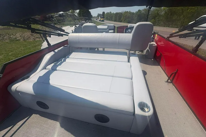 Slide: The Image of 2023 Bentley Pontoons Legacy 223 SB interior with white seating and red accents. - 7