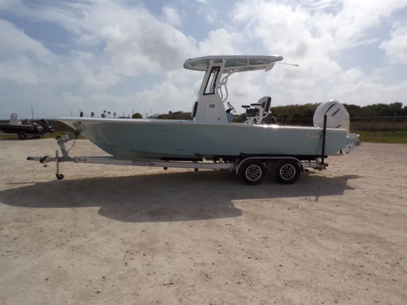 The Image of 2026 Tidewater 2500 Carolina Bay boat on trailer outdoors. - 1