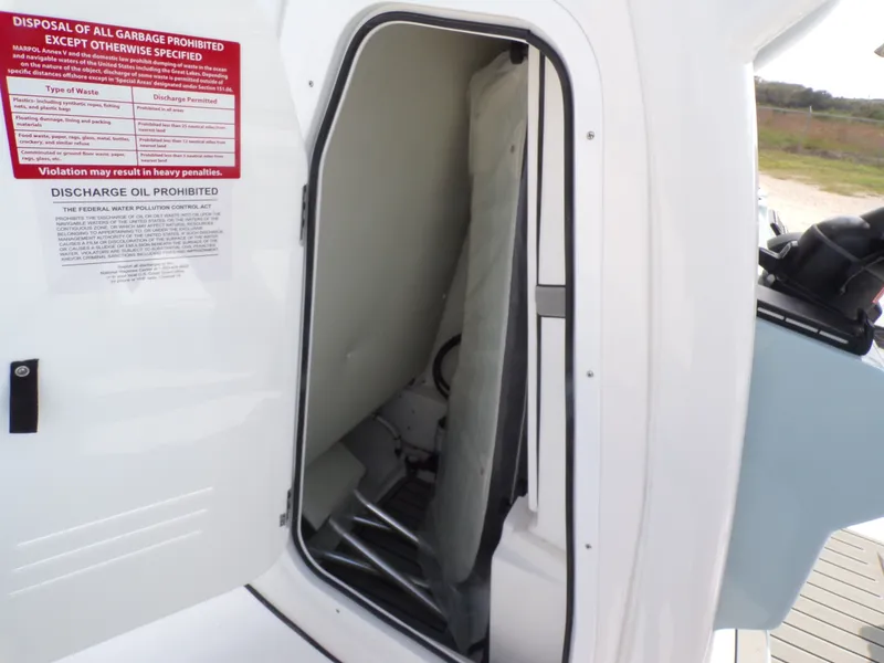 Slide: The Image of Interior of Tidewater 2500 Carolina Bay 2026 with waste disposal instructions. - 33