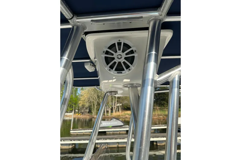 Slide: The Image of 2015 Sea Hunt BX 22 Pro boat with mounted speaker and metal framework. - 6