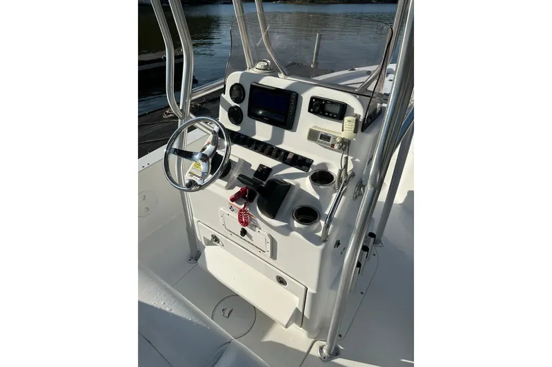 Slide: The Image of 2015 Sea Hunt BX 22 Pro boat console with steering wheel and navigation equipment. - 7