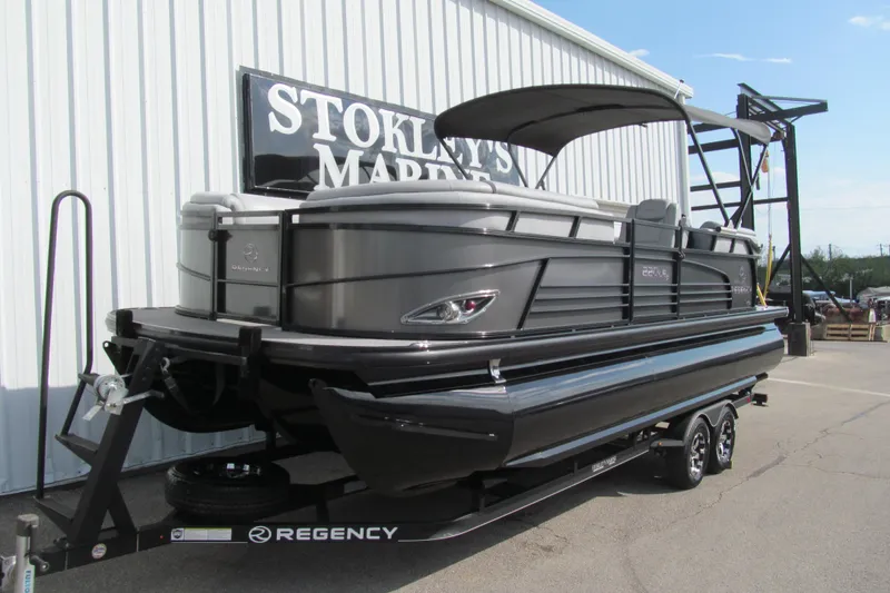 Slide: The Image of 2017 Regency 220 LE3 pontoon boat on trailer at Stokley's Marine. - 2