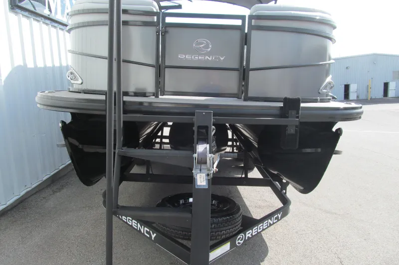 Slide: The Image of 2017 Regency 220 LE3 pontoon boat on trailer, rear view in outdoor setting. - 5