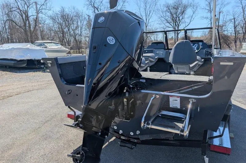 Slide: The Image of 2026 Starcraft Superfisherman 186 boat with powerful outboard motor, parked outdoors. - 16