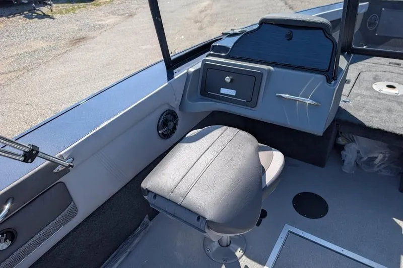 Slide: The Image of Interior of 2026 Starcraft Superfisherman 186 boat, featuring seating and dashboard. - 19