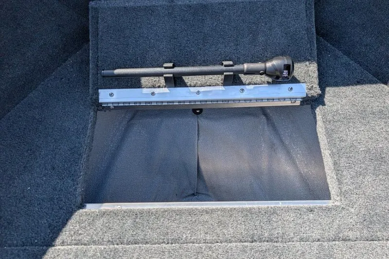 Slide: The Image of Carpeted storage compartment in 2026 Starcraft Superfisherman 186 boat with mounted flashlight. - 23