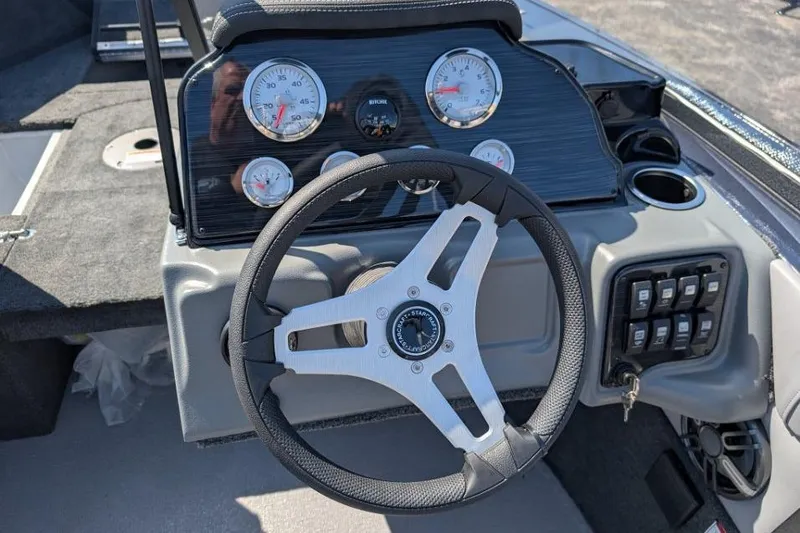 Slide: The Image of 2026 Starcraft Superfisherman 186 dashboard with steering wheel and gauges. - 24