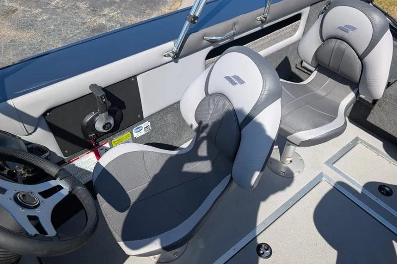 Slide: The Image of Interior of 2026 Starcraft Superfisherman 186 boat with gray seating and steering wheel. - 26