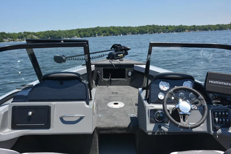 Slide: The Image of Manufacturer Provided Image: 2026 Starcraft Superfisherman 186 boat interior on a lake. - 5