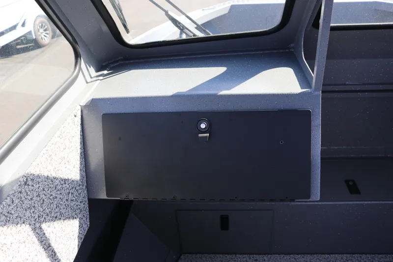 Slide: The Image of Interior view of 2026 Alumaweld Stryker 202 boat dashboard with storage compartment. - 10