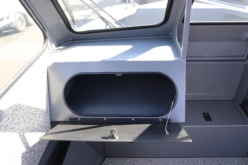 Slide: The Image of 2026 Alumaweld Stryker 202 boat interior storage compartment with open hatch. - 11