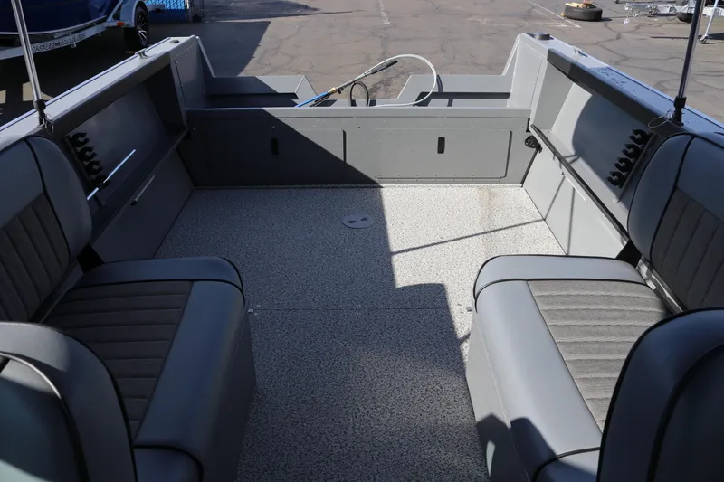 Slide: The Image of 2026 Alumaweld Stryker 202 boat interior with gray seating and spacious deck. - 12