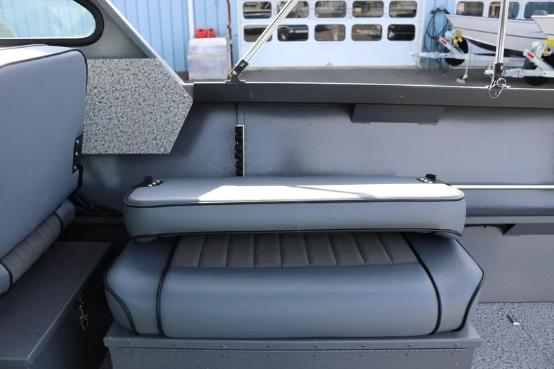 Slide: The Image of Interior seating of 2026 Alumaweld Stryker 202 boat, featuring gray cushioned seats. - 15