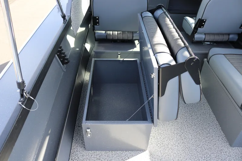 Slide: The Image of 2026 Alumaweld Stryker 202 boat interior with open storage compartment and seating. - 16