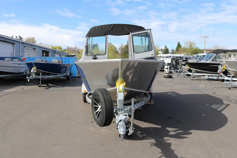 Slide: The Image of 2026 Alumaweld Stryker 202 boat on trailer in outdoor dealership lot. - 2