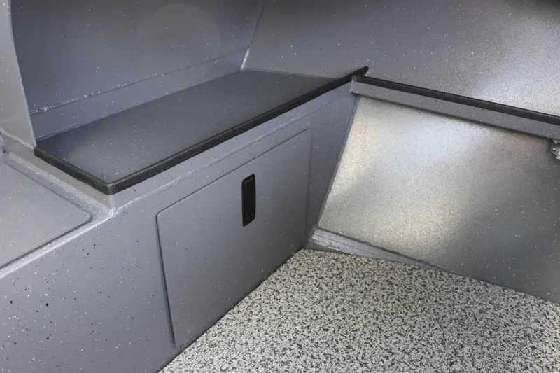 Slide: The Image of Interior of 2026 Alumaweld Stryker 202 boat, featuring storage compartment and seating area. - 22