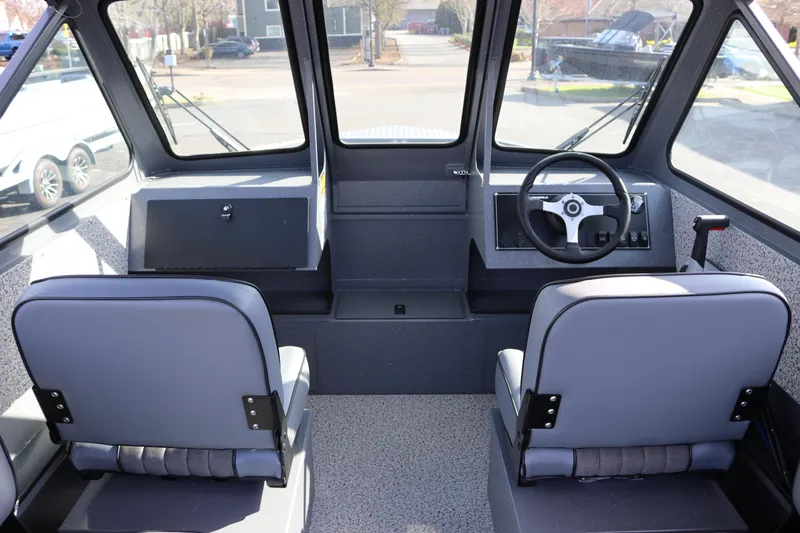 Slide: The Image of Interior of 2026 Alumaweld Stryker 202 boat, featuring dual seats and steering console. - 4