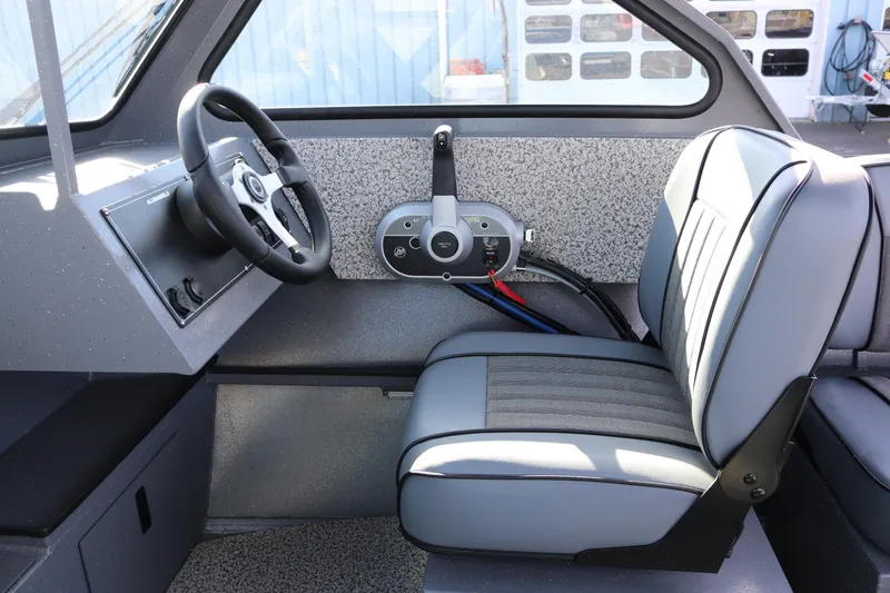 Slide: The Image of Interior of 2026 Alumaweld Stryker 202 boat, featuring steering wheel and seating. - 5