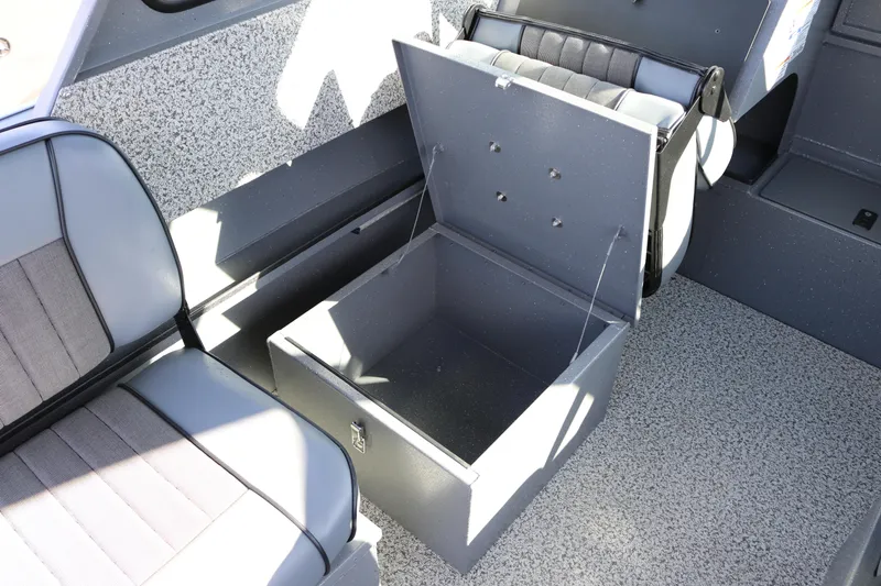 Slide: The Image of 2026 Alumaweld Stryker 202 boat interior with open storage compartment and seating. - 9