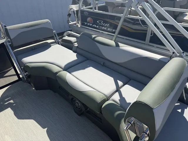 Slide: The Image of 2026 Tahoe LTZ Quad Lounger with gray upholstery on a boat. - 14