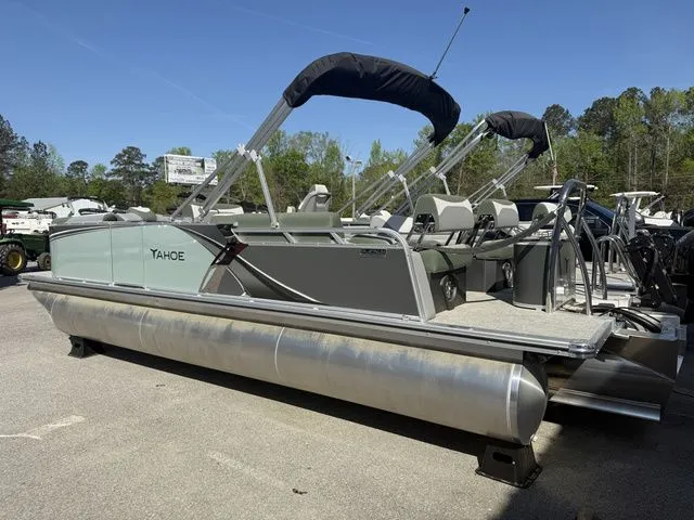 Slide: The Image of 2026 Tahoe LTZ 23 FT Quad Lounger pontoon boat outdoors. - 3