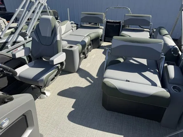Slide: The Image of Interior of 2026 Tahoe LTZ Quad Lounger boat with gray seating. - 7