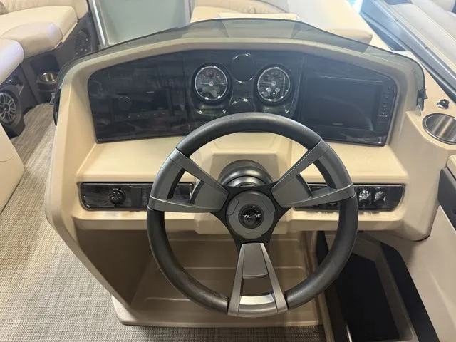 Slide: The Image of Steering console of the 2026 Tahoe LTZ Quad Lounger boat. - 10