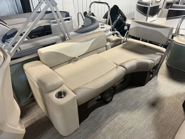 Slide: The Image of 2026 Tahoe LTZ Quad Lounger with beige seating and cup holders. - 11