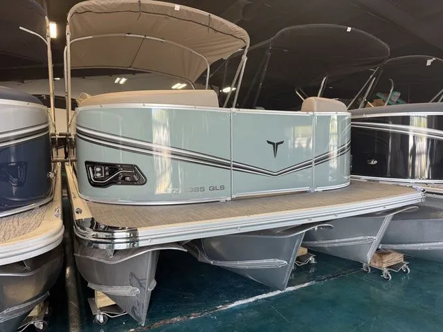 Slide: The Image of 2026 Tahoe LTZ Quad Lounger boat in showroom. - 4