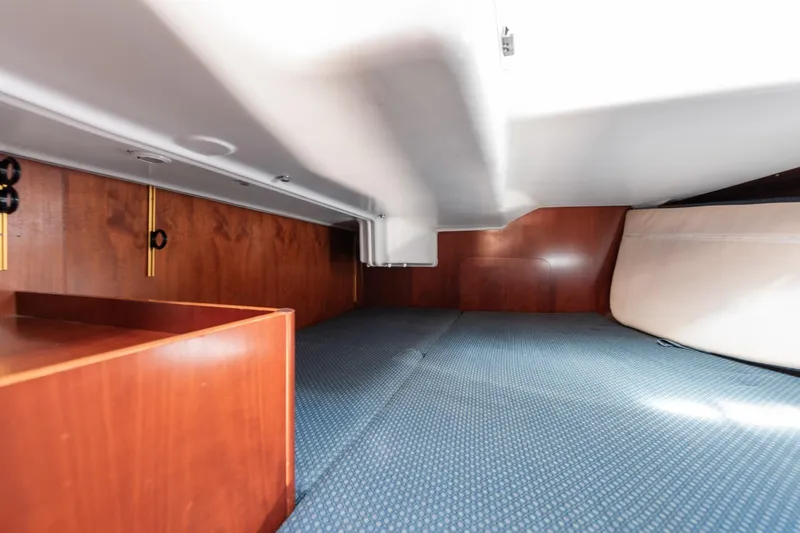 Slide: The Image of Bathroom interior of 2003 Beneteau 411 yacht with toilet, sink, and towels. - 16