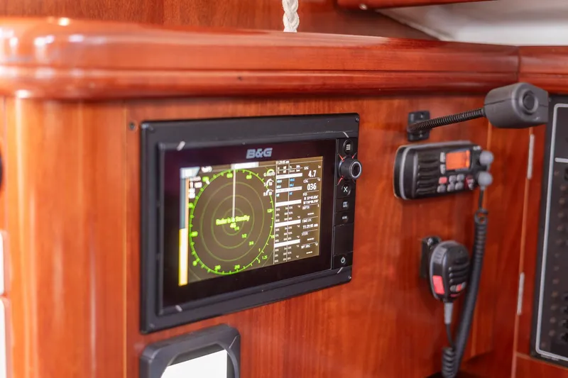 Slide: The Image of 2003 Beneteau 411 yacht bathroom with blue towels and compact toilet. - 18