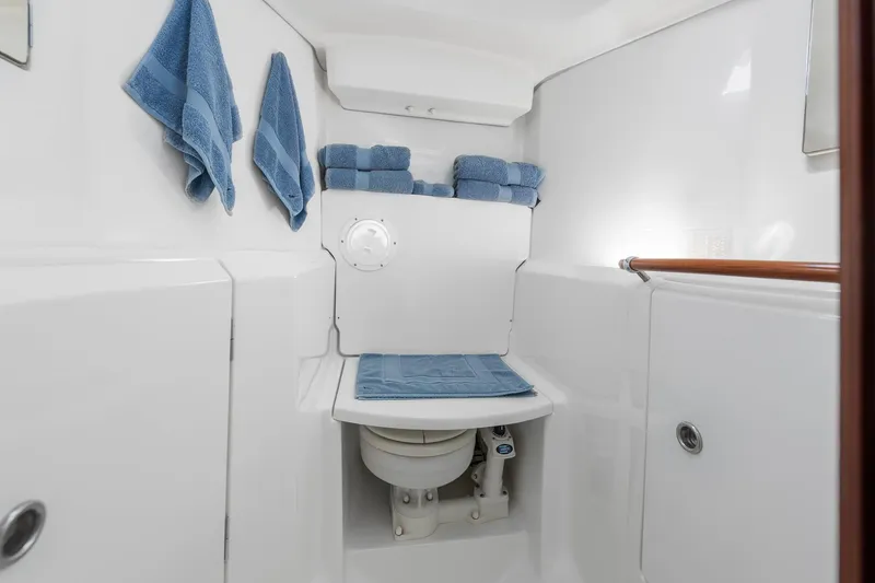 Slide: The Image of 2003 Beneteau 411 sailboat on calm blue water under clear sky. - 19