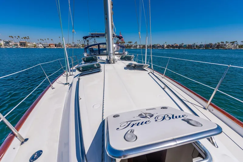 Slide: The Image of Sailing on a 2003 Beneteau 411 yacht in a sunny marina. - 22