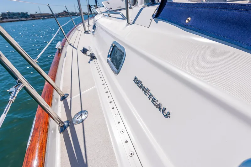 Slide: The Image of Cockpit of 2003 Beneteau 411 sailboat with wooden deck and steering wheel. - 24