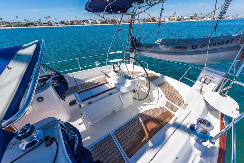 Slide: The Image of Cockpit of 2003 Beneteau 411 sailboat with steering wheel and navigation equipment. - 25