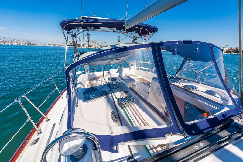 Slide: The Image of Close-up of 2003 Beneteau 411 yacht deck with polished metal fittings and blue accents. - 29