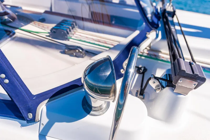 Slide: The Image of Cockpit of a 2003 Beneteau 411 sailboat with ocean view and clear blue skies. - 30