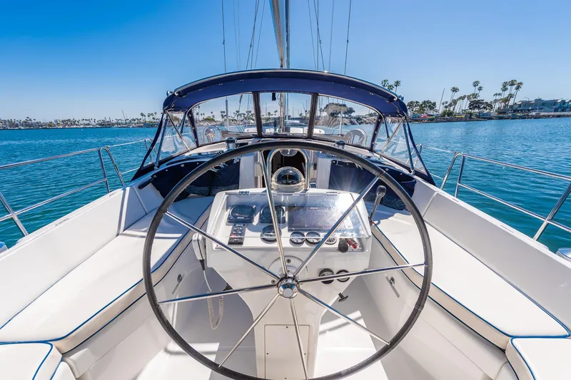 Slide: The Image of Deck view of a 2003 Beneteau 411 sailboat on blue water. - 33
