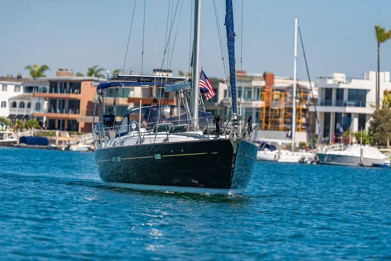 Slide: The Image of Front view of a 2003 Beneteau 411 sailboat on calm water. - 37