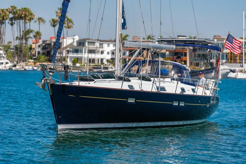 Slide: The Image of Beneteau 411 sailboat, 2003 model, docked at Alamitos Bay, CA with dinghy. - 39