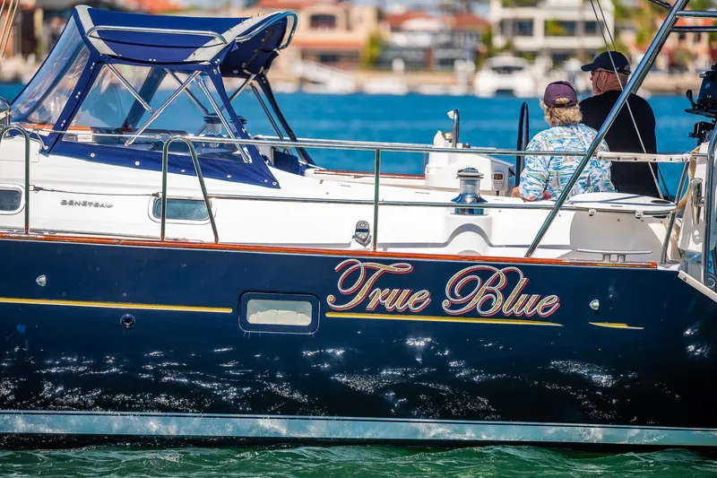 Slide: The Image of Coiled rope on 2003 Beneteau 411 yacht deck, near a hatch window. - 41
