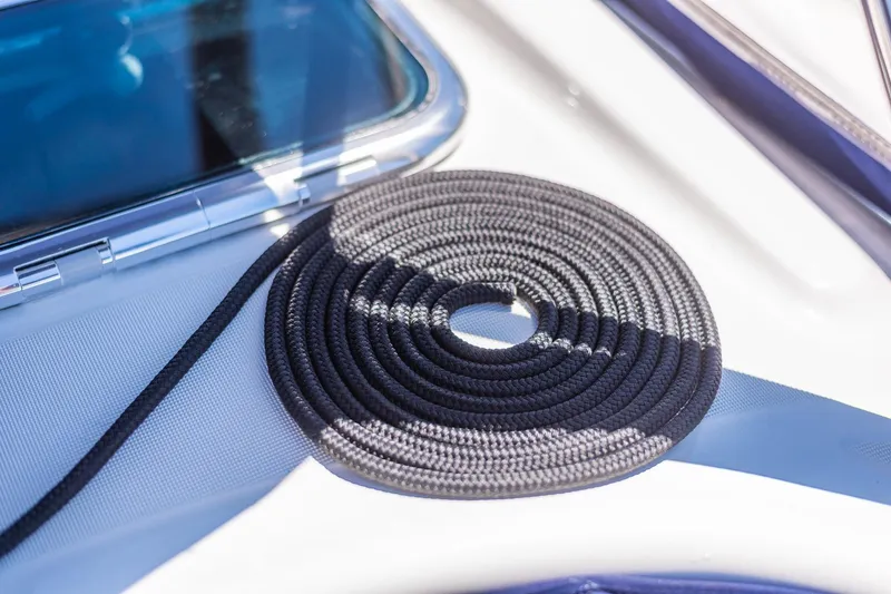 Slide: The Image of Deck of 2003 Beneteau 411 sailboat with winch and ropes. - 42