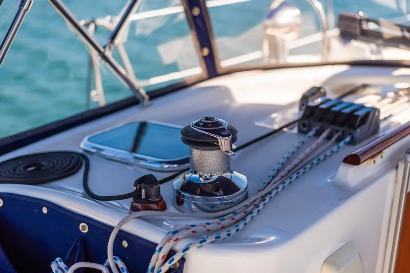 Slide: The Image of Close-up of a 2003 Beneteau 411 yacht's polished metal railing and deck fittings. - 43