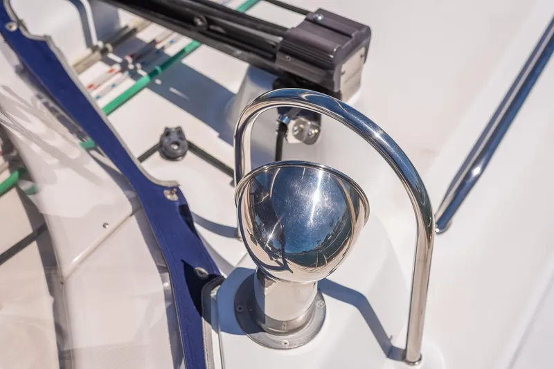 Slide: The Image of Outboard motor on a 2003 Beneteau 411 sailboat, docked on water. - 44