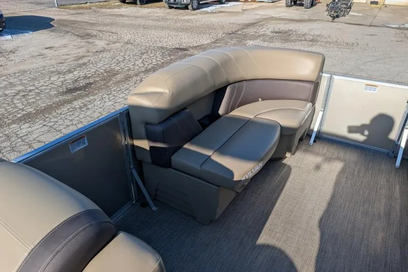 Slide: The Image of 2023 Sylvan Mirage 818 Cruise boat interior with beige seating and carpeted floor. - 6