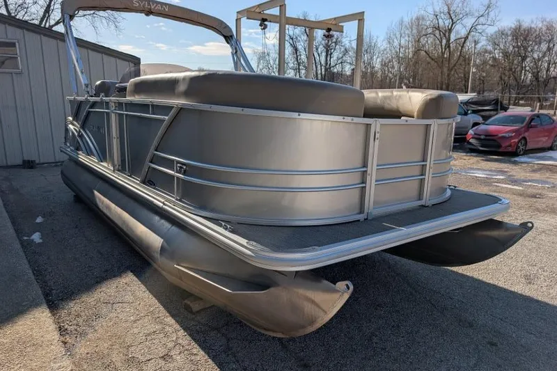 Slide: The Image of 2023 Sylvan Mirage 818 Cruise pontoon boat parked outdoors. - 9