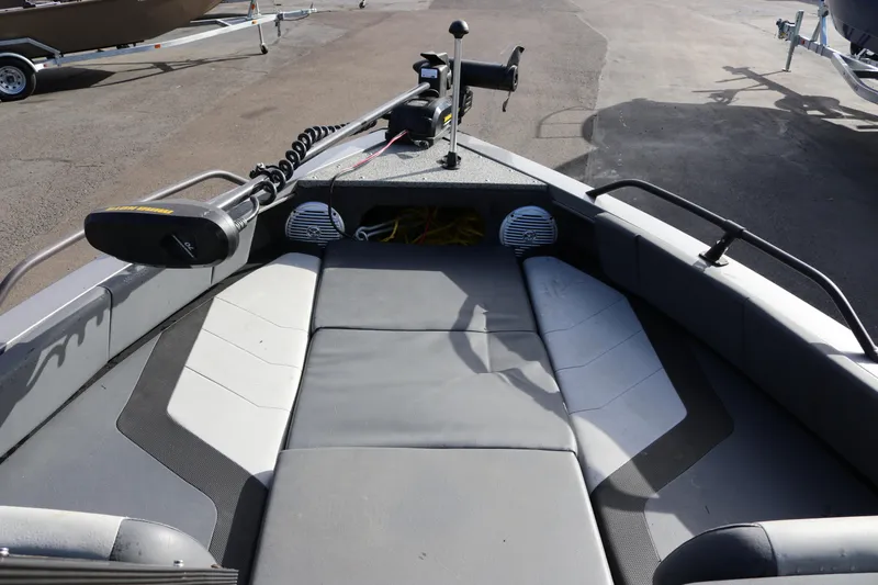 Slide: The Image of 2017 Lowe Fish & Ski 175 boat interior with seating and trolling motor. - 10